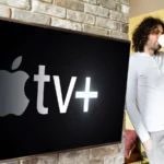 Man sipping coffee near Apple TV.