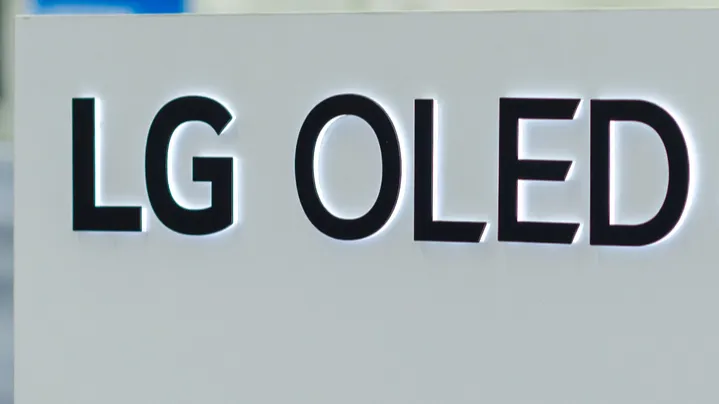 LG OLED displayed on a white board