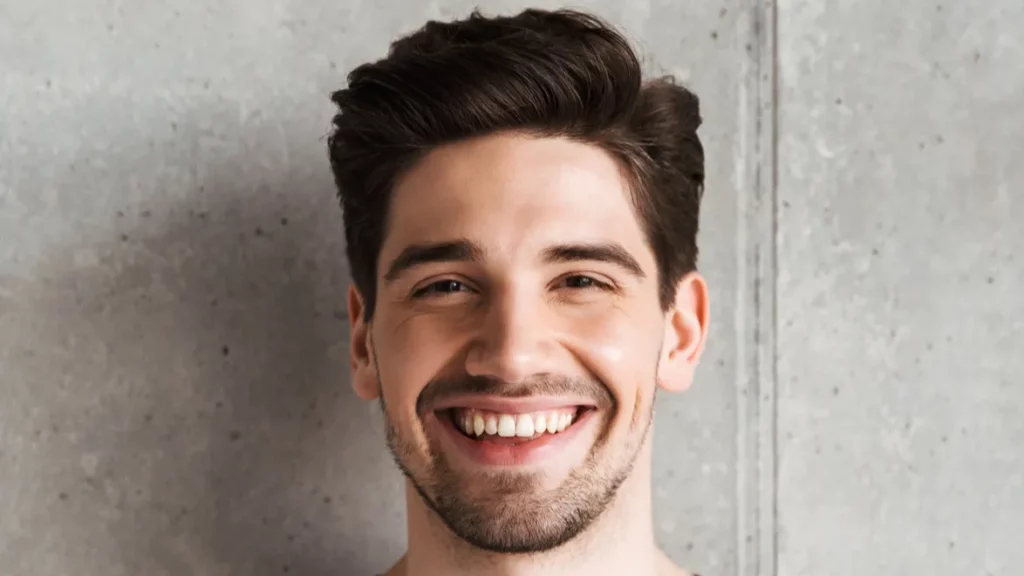 Happy young man smiling
