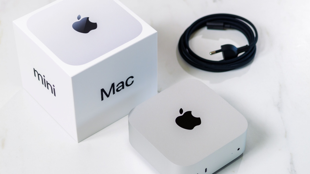 Apple Mac Mini placed with box and cable