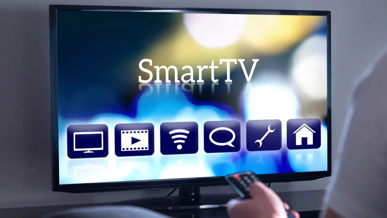 A man watching controlling smart TV from dashboard.