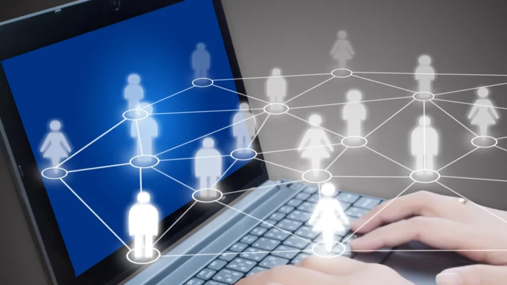 Laptop with connected human network icons.