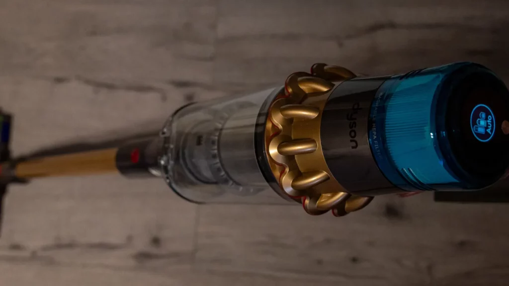 A Dyson vaccum cleaning the floor