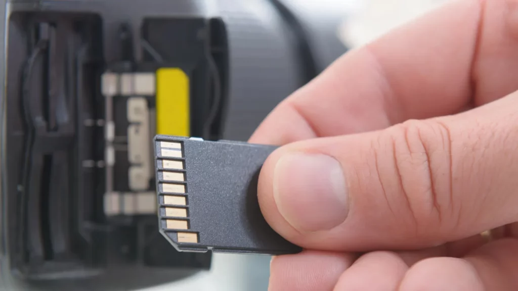 A man holding SD card.