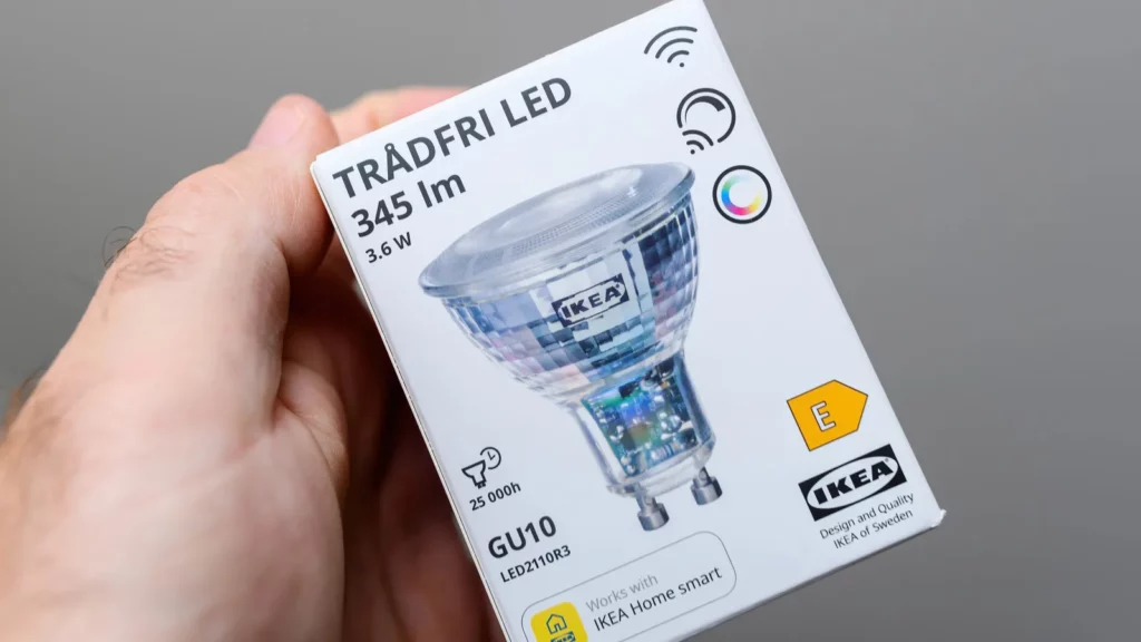 A man holding IKEA smart device.