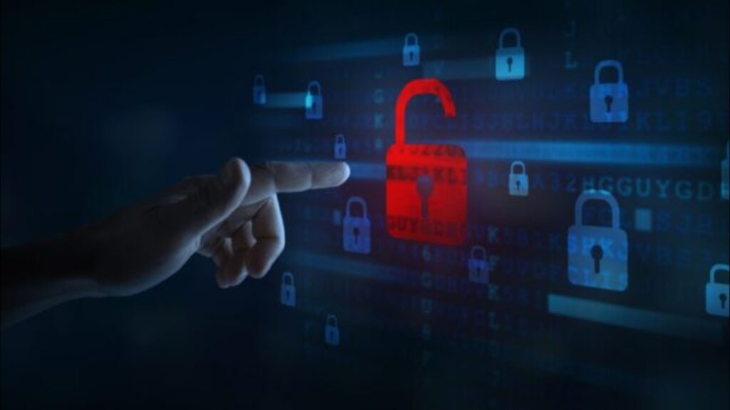 Hand touching an unlocked padlock.