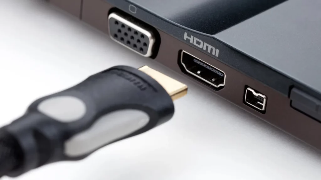 Laptop ports with HDMI cable.