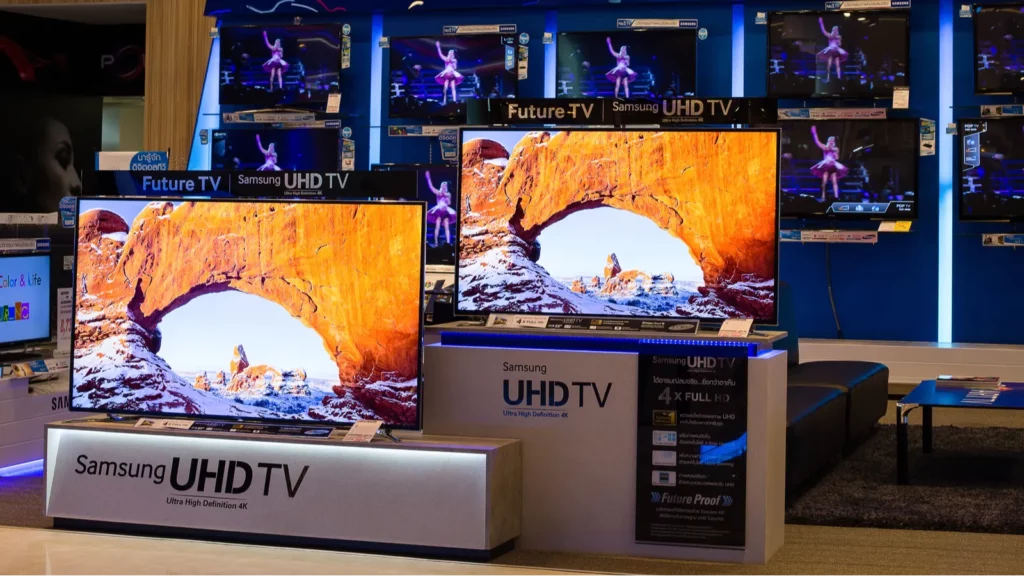 Samsung UHD TVs displaying a canyon scene.