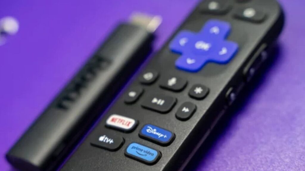 Roku Streaming Stick with remote on a purple background.