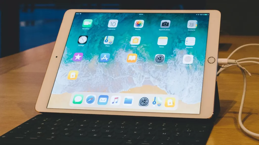 iPad on keyboard with cables.