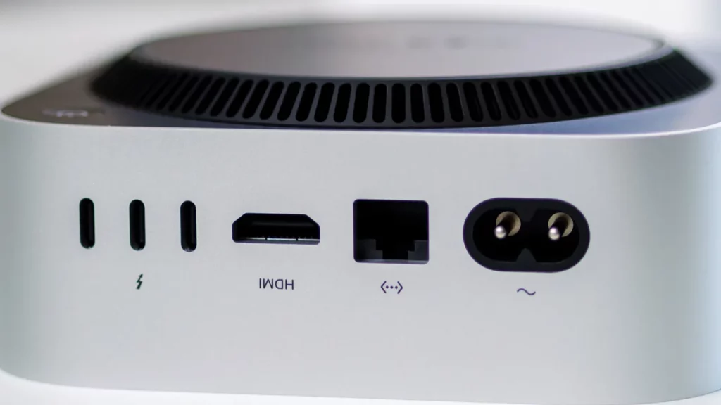 Mini PC rear panel showing USB-C, HDMI, Ethernet, and power ports.