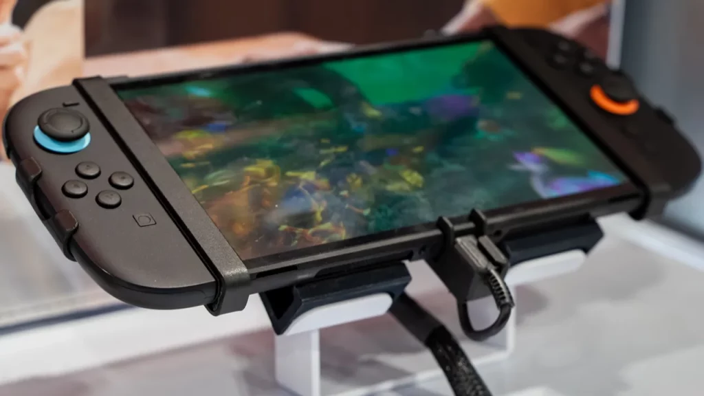 Handheld gaming device displaying a colorful game.