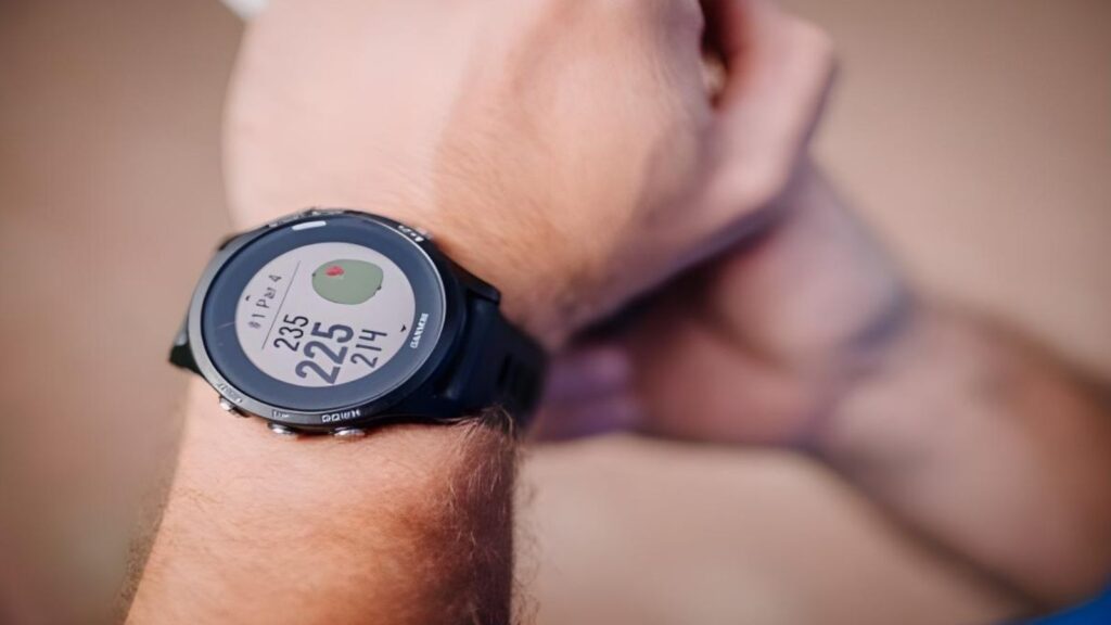 Black smartwatch with fitness stats.