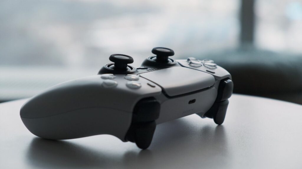 White game controller on a table.