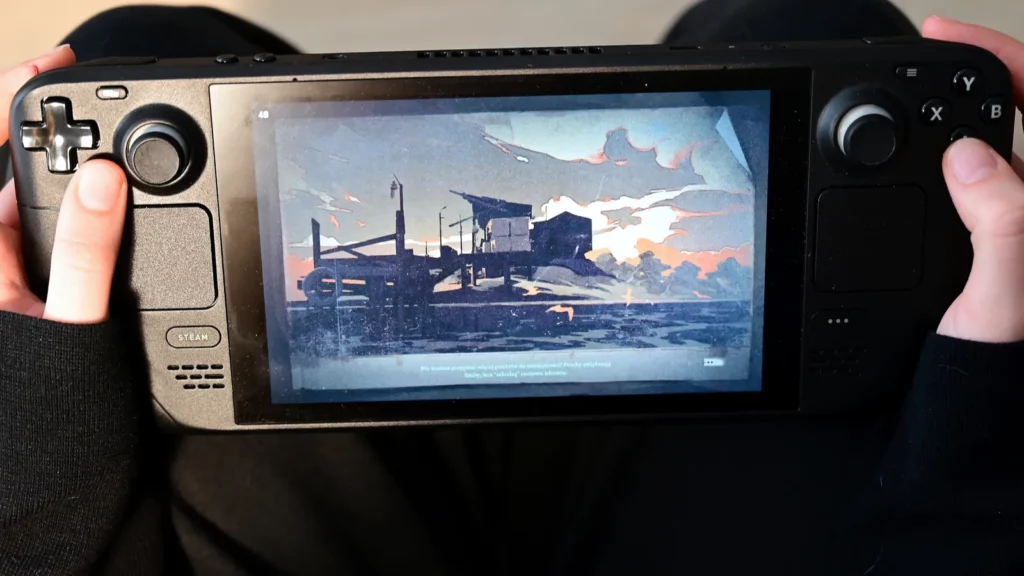 Person holding a gaming handheld.